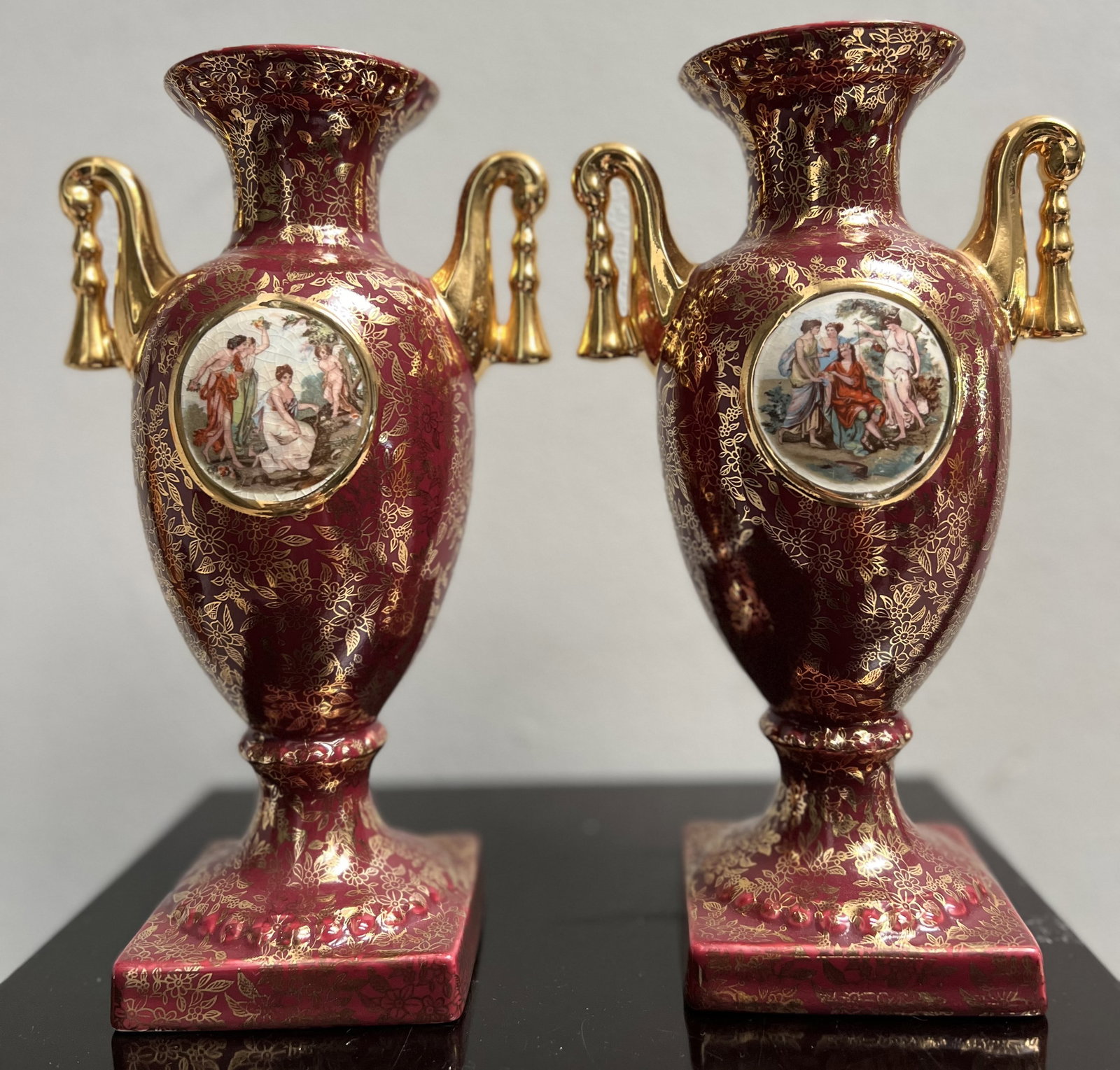 Vintage Pair of Empire English Urns: This vintage pair of Empire English Urns is a stunning addition to any collection. Made of high-quality porcelain, these medium-sized urns feature a glazed finish and are designed in the classic Engli
