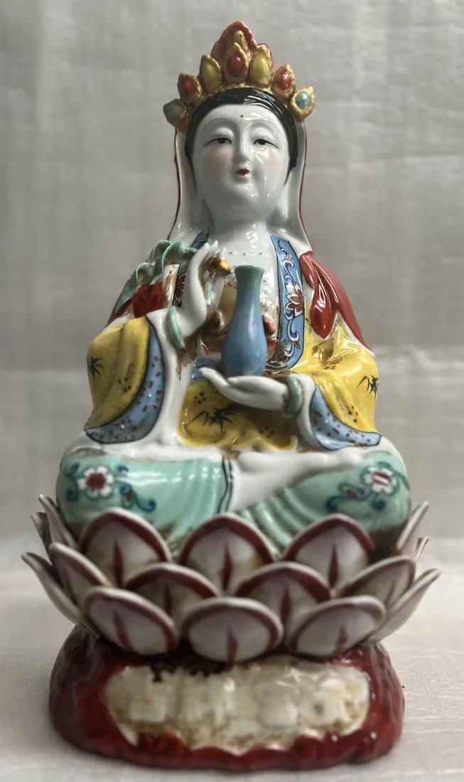 GUANYIN SITTING ON THE LOTUS CERAMIN GUANIN BUDDHA OPEN THE LIGHT: This beautiful medium-sized Buddha statue features the peaceful figure of Guanyin sitting on a lotus flower. The statue is made of high-quality ceramic and has an antique finish that adds to its charm