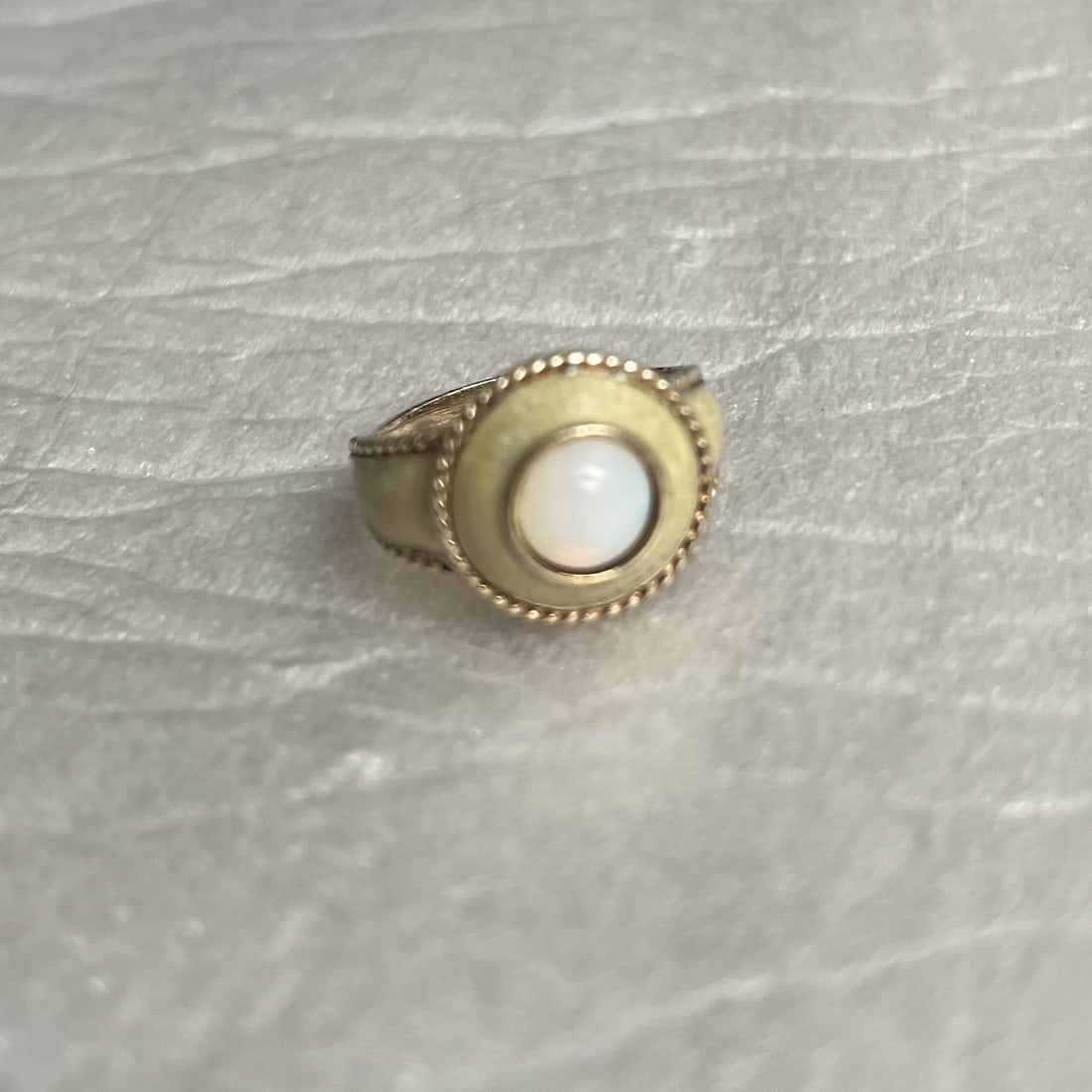 10K Yellow Gold Ring with Opal Stone size 6: This product is a 10K yellow gold ring with a round opal stone in size 6, designed by Kay Jewelers. The ring features a natural opal stone as the main stone, set in a base of yellow gold. The combinat