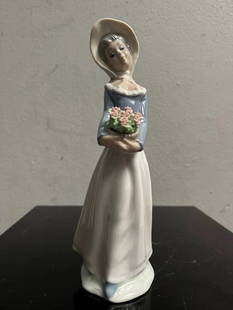 Tengra Valencia Spain Figurine Girl with Bonnet & Flowers: Crafted with meticulous attention to detail, this Tengra Valencia Spain figurine captures the essence of childhood charm. The piece features a delightful girl adorned with a bonnet and flowers,