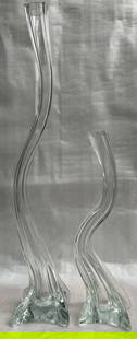 Pair of Crystal Wave Candle Holders Signed by the Artist: Elevate your home decor with this exquisite pair of crystal wave candle holders, masterfully crafted by Jim Mani. Each piece showcases the timeless elegance of Art Deco design, with a sleek,