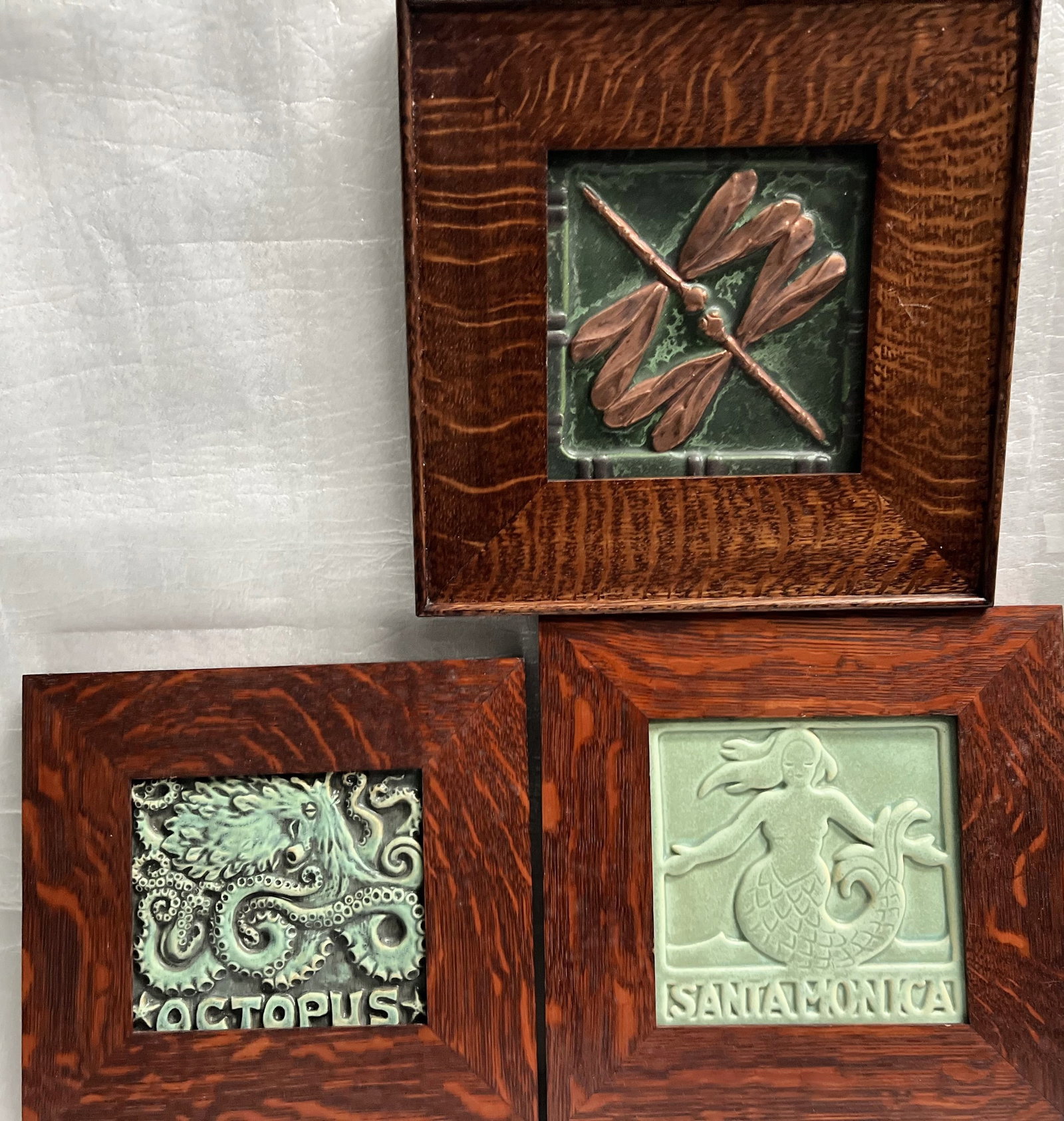 Set of 3 Relief Sculptured Art Pottery Framed: The product is a set of three relief sculpted art pottery pieces, each measuring 9x9 inches when framed. These original sculptures are crafted from clay using pottery techniques, making them a unique 