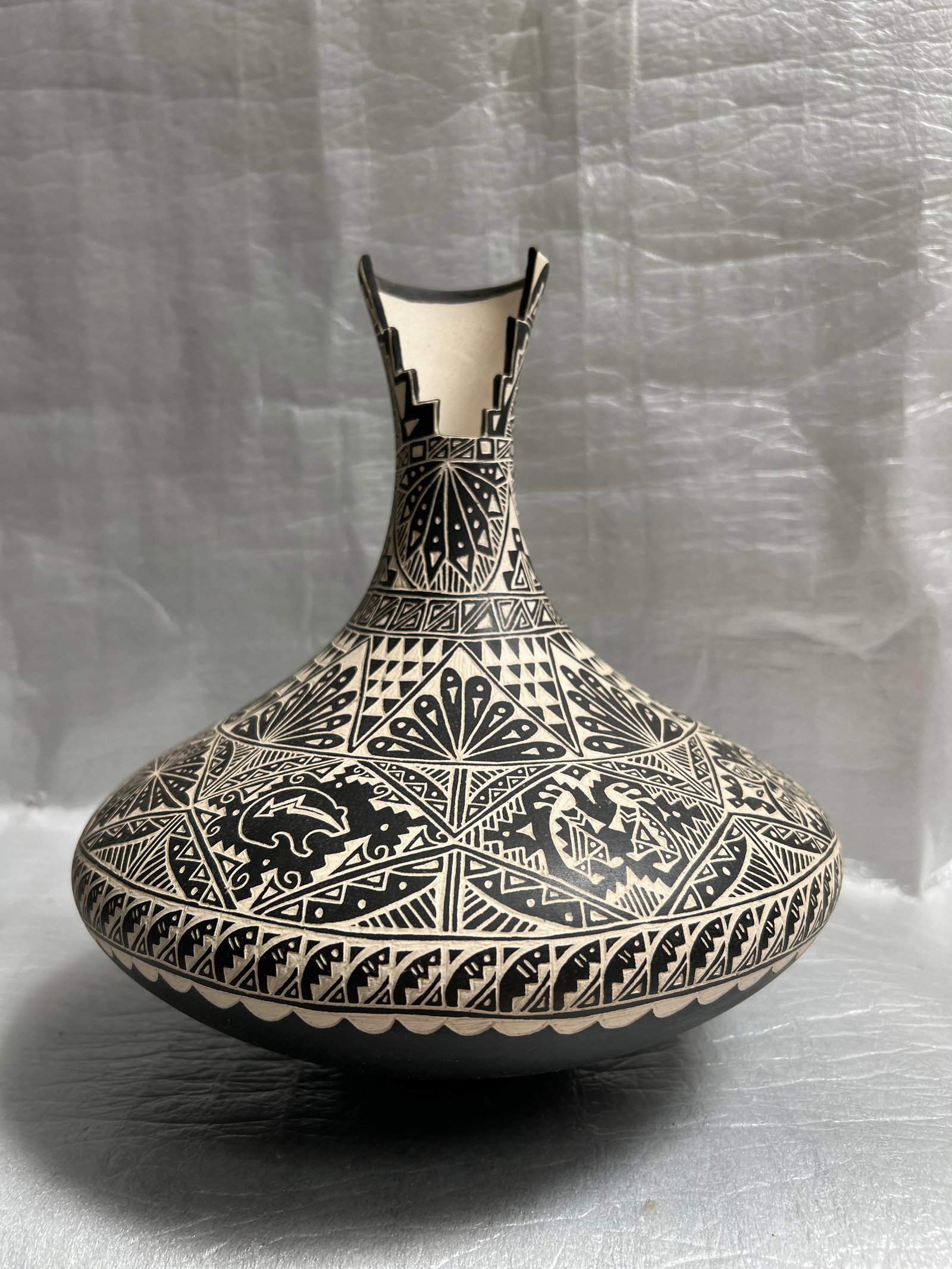 Karen Miller "Acoma Bear Paw Pottery Cantenne" Vase: The Karen Miller "Acoma Bear Paw Pottery Cantenne" vase is a handmade piece originating from the Mid West, specifically associated with the Navajo tribe. Made in the United States, this Native America