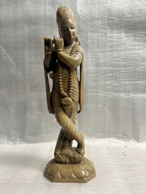 A Hand Carved Stone Statue of Lord Krishna , a Prominent Deity in Hinduism