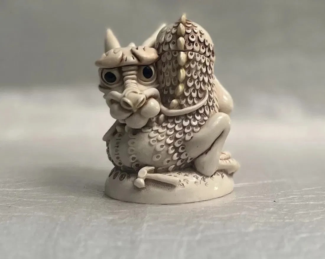 HARMONY KINGDOM "SAINT OR SINNER" INFINITY VERSION MINI STATUE: This exquisite mini statue from Harmony Kingdom is a must-have for any collector of decorative items. The intricately designed piece features a mix of materials, including bone, and boasts a beige col
