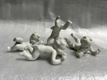 Set of 4 White Porcelain Cherubs at Play