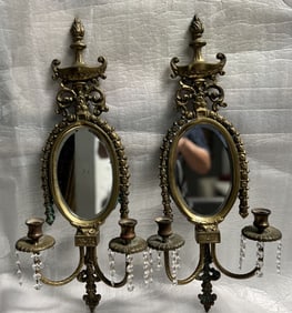 Pair of vintage brass mirrored wall sconces, designed to hold candles.