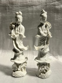 A pair of elegant white porcelain figurines, commonly known as Blanc de Chine, depicting Guanyin