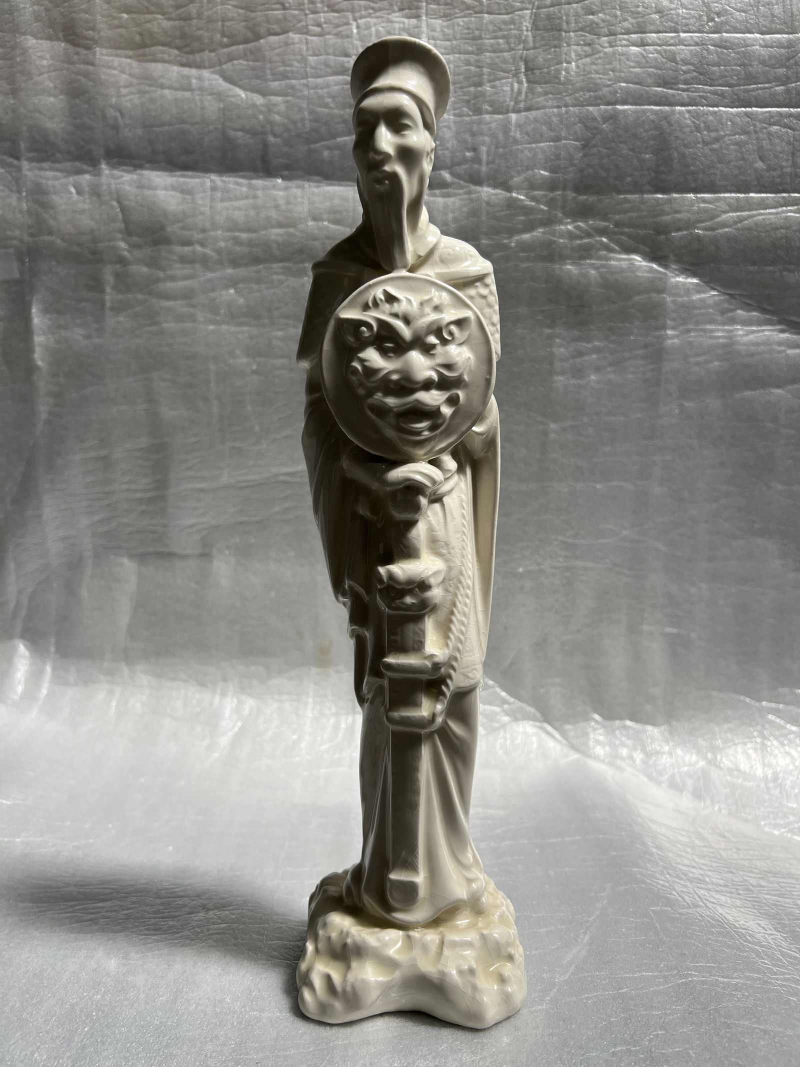 White porcelain figure, likely of Chinese origin, depicting a warrior or a significant figure holdi (1 of 5)