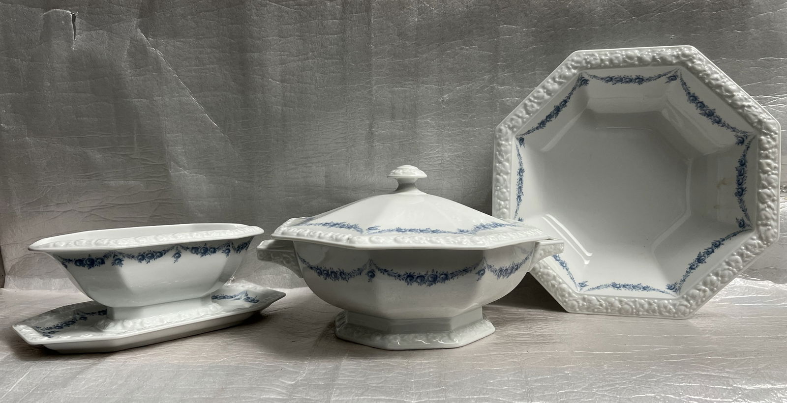 Set of 3,Serving Bowl, Covered Bowl and Gravey Boat Vintage Rosenthal Maria Porcelain Circa 1960s: Product: Rosenthal Maria porcelain dinnerware, specifically the "Maria Rosenkante Blau" or "Dream Blue" pattern. Design: Features a polygonal shape with a characteristic embossed fruit wreath rim and