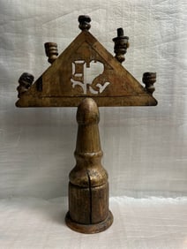 A hand-carved wooden altar candle holder from an Italian church, likely dating back to the 1600s (1