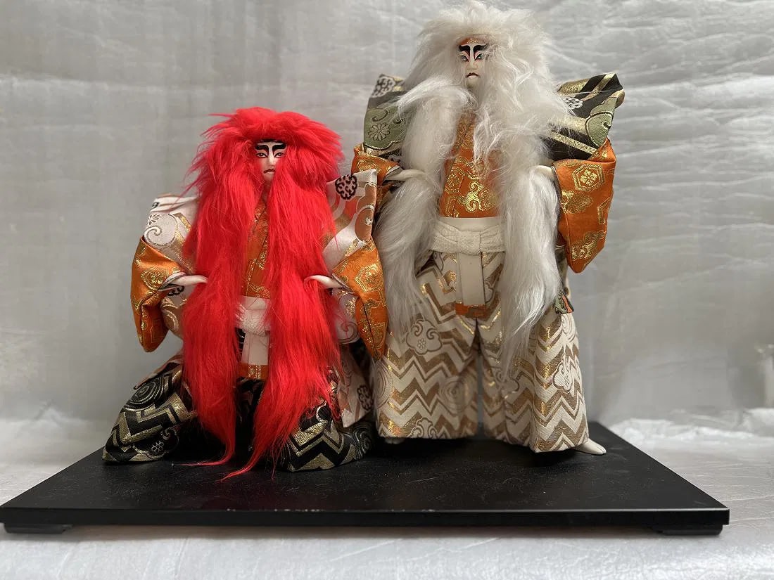 Japanese Kabuki Renjishi Lion Dancer Dolls: This Japanese Kabuki Renjishi Lion Dancer Doll set is a beautiful representation of Japanese culture and tradition. The dolls were crafted in Japan and showcase intricate details that make them a uniq