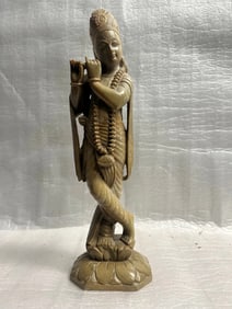 A Hand Carved Stone Statue of Lord Krishna , a Prominent Deity in Hinduism