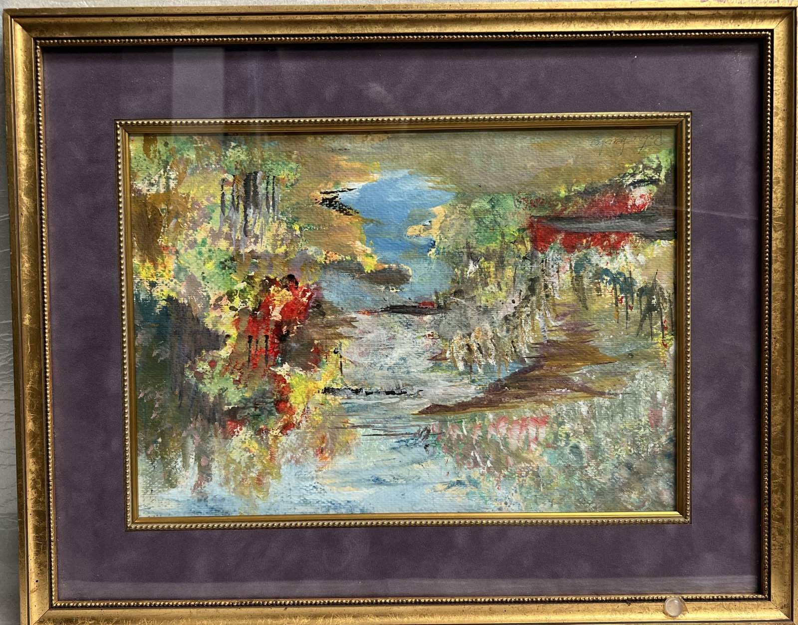 An impressionistic landscape rendered in thick, textured brushstrokes signed by the artist: an impressionistic landscape rendered in thick, textured brushstrokes. It depicts a flowing river or stream cutting through a colorful natural scene, with reflections suggesting movement in the water.