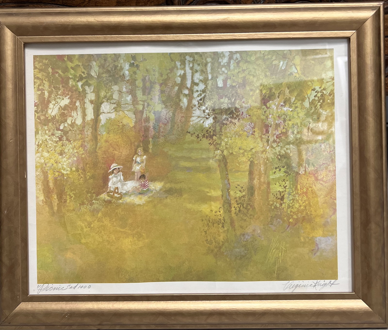 Virginia Knight "Picnic" Framed Limited Ed Hand Signed and Numbered: framed, limited edition offset lithograph print titled "Picnic" by American artist Virginia Knight. The print depicts an impressionistic outdoor scene with three children in a lush, green and yellow l