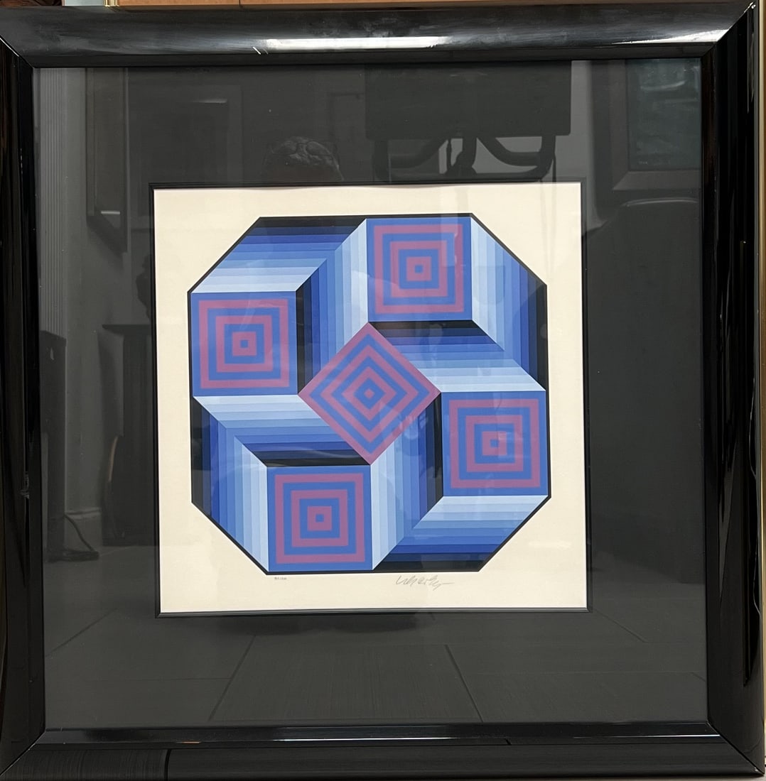 Victor Vasarely " Octa" Framed Silkscreen Print Hand Signed: The image displays a framed silkscreen print titled Octa by the Hungarian-French artist Victor Vasarely. Vasarely is widely recognized as the leader and "father" of the Op Art movement, which uses geo