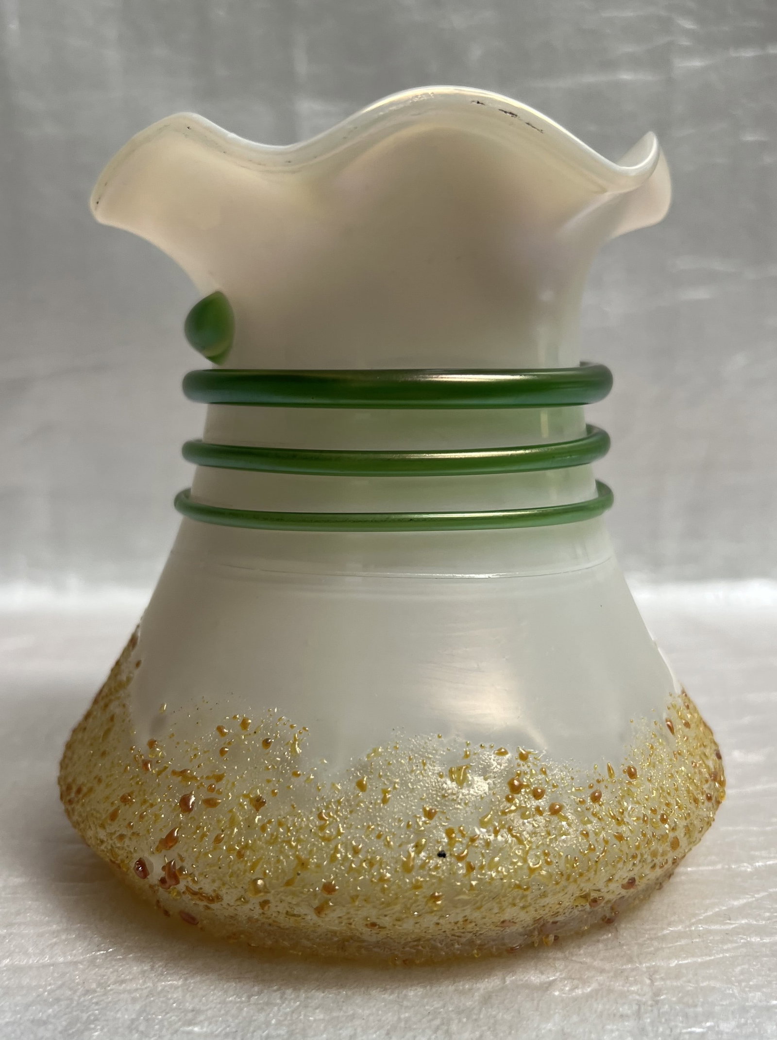 Kralik Art Nouveau Bohemian Glass Vase: Kralik Vase The item in the image is an antique Art Nouveau Bohemian glass vase, likely manufactured by Kralik, featuring iridescent glass with applied green cording and amber frit decoration. Style a