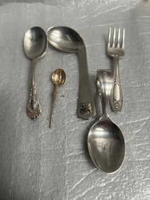 A collection of miscellaneous sterling silver flatware pieces