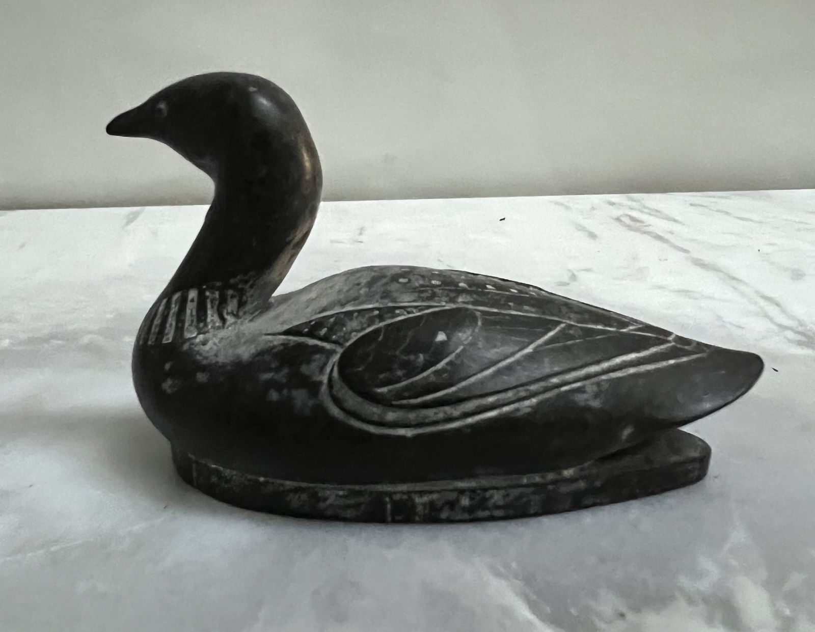 Vintage Pearlite Stonecraft Miniature Loon - Handcrafted Canada - 3" Long: A charming, miniature representation of the Canadian Common Loon by Pearlite Stonecraft. This small but weighty figurine is handcrafted from a stone composite, featuring a polished dark finish and del