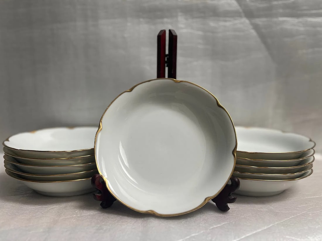 Set of 11 (Eleven) 8" Bowls O & E Royal Austria with 24K Gold Trim: This elegant set of 11 round bone china bowls is sure to impress. The bowls feature a beautiful white color and are adorned with a 24K gold trim. Made in Austria by Royal, these original bowls are a v