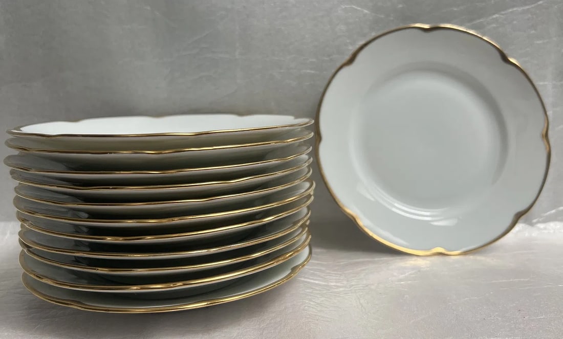 Set of 12 (Twelve) 6.5" Side Dishes O & E Royal Austria with 24K Gold Trim: Add a touch of elegance to your dining experience with this set of 12 side dishes from Royal Austria. The round bone china plates feature a stunning 24K gold trim that adds a luxurious touch to your t