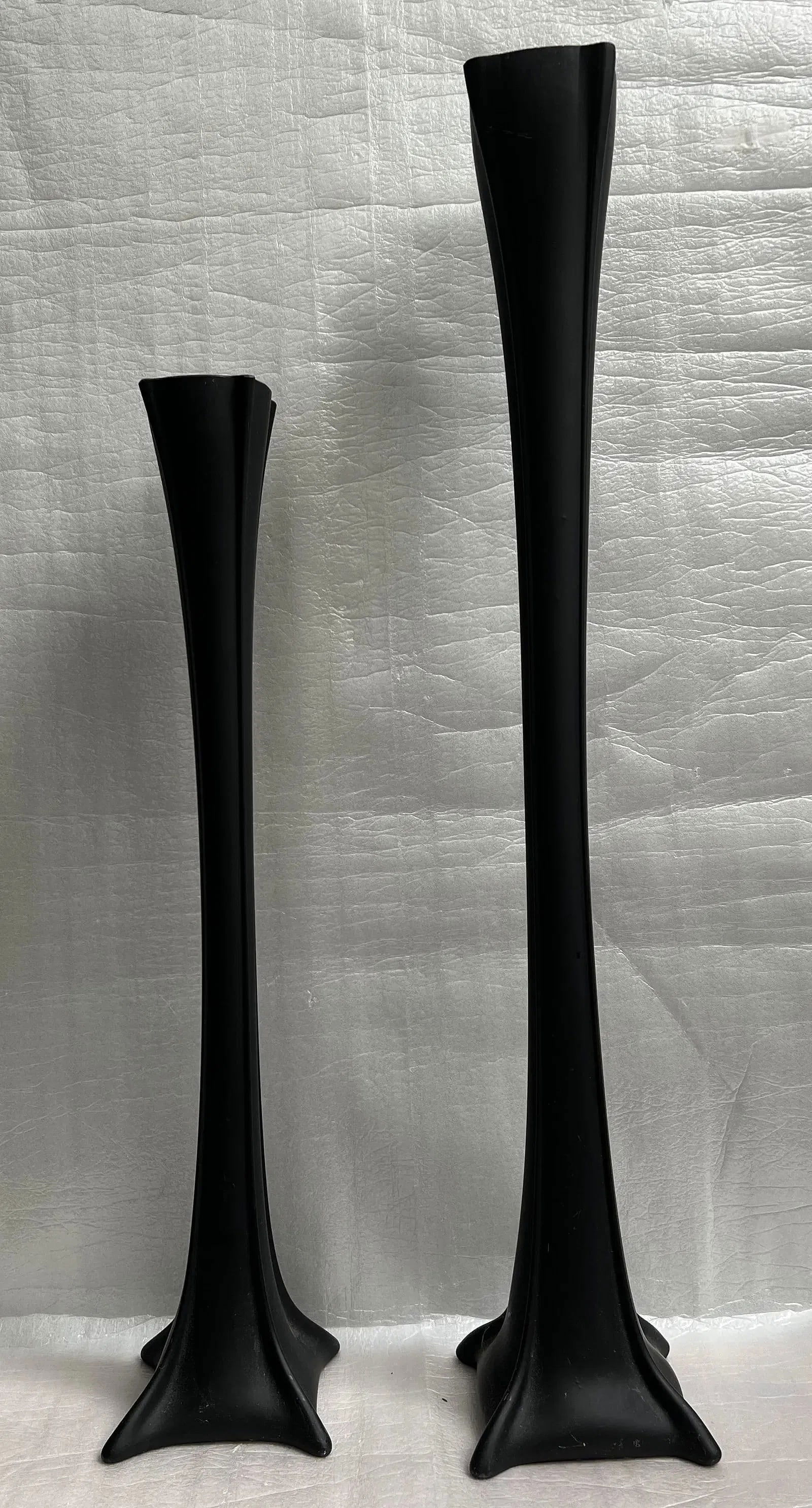 Set of 2 Black Ceramic Flower/ Eiffel Tower Vases (1) 36" (1) 29": Add a touch of modern elegance to your home decor with this set of two black ceramic flower/Eiffel Tower vases. The vases feature a sleek and stylish design that is perfect for displaying your favorit