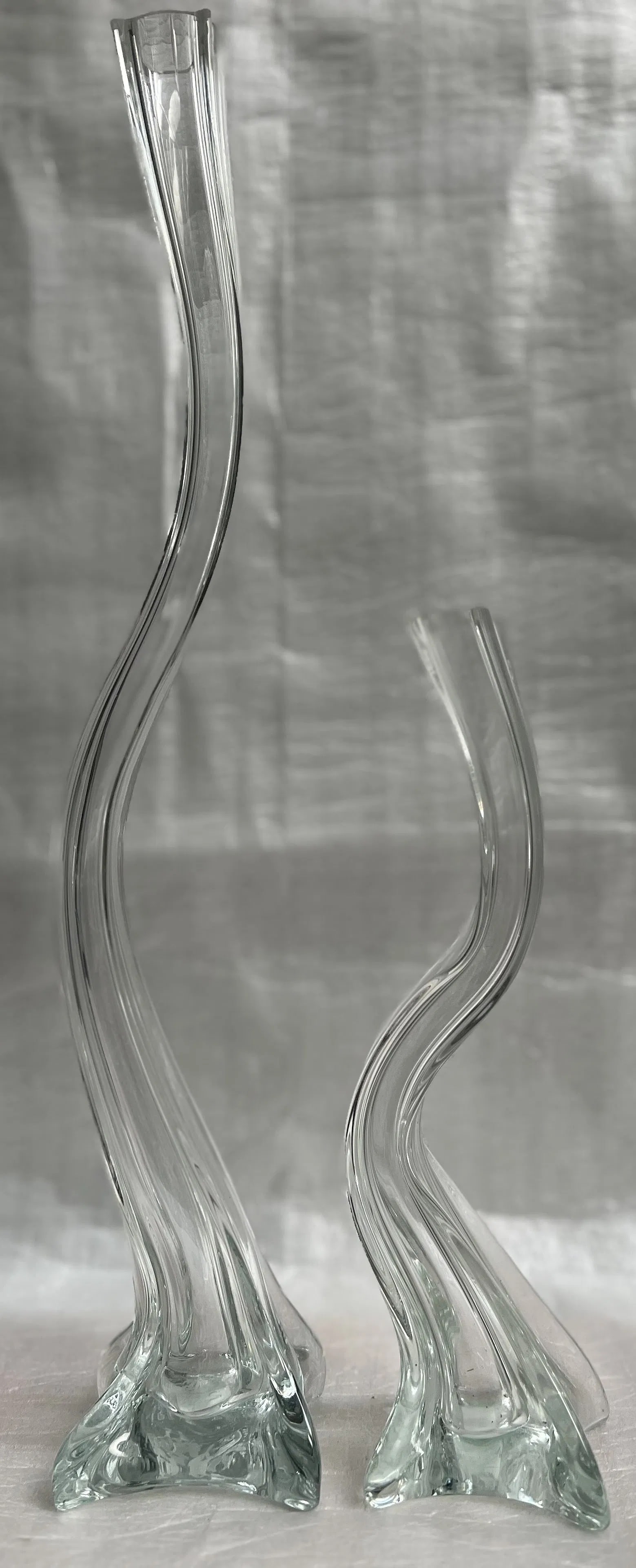 Pair of Crystal Wave Candle Holders Signed by the Artist: Elevate your home decor with this exquisite pair of crystal wave candle holders, masterfully crafted by Jim Mani. Each piece showcases the timeless elegance of Art Deco design, with a sleek, hand-blow
