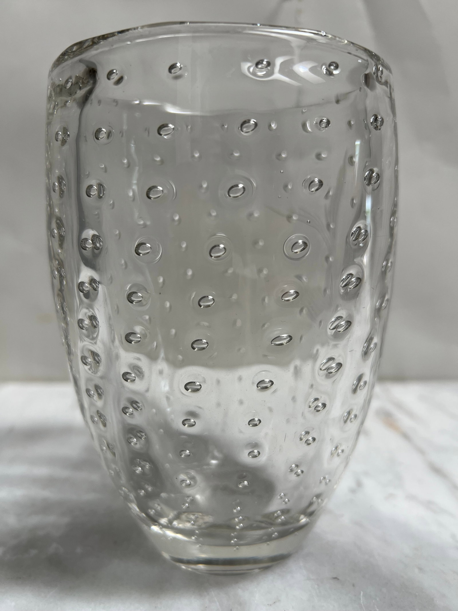 Mid-Century Modern Controlled Bubble Clear Art Glass Vase c. 1950: A stunning mid-century modern art glass vase featuring a meticulously executed controlled bubble (bullicante) pattern. This piece dates to approximately 1950 and showcases the high-quality