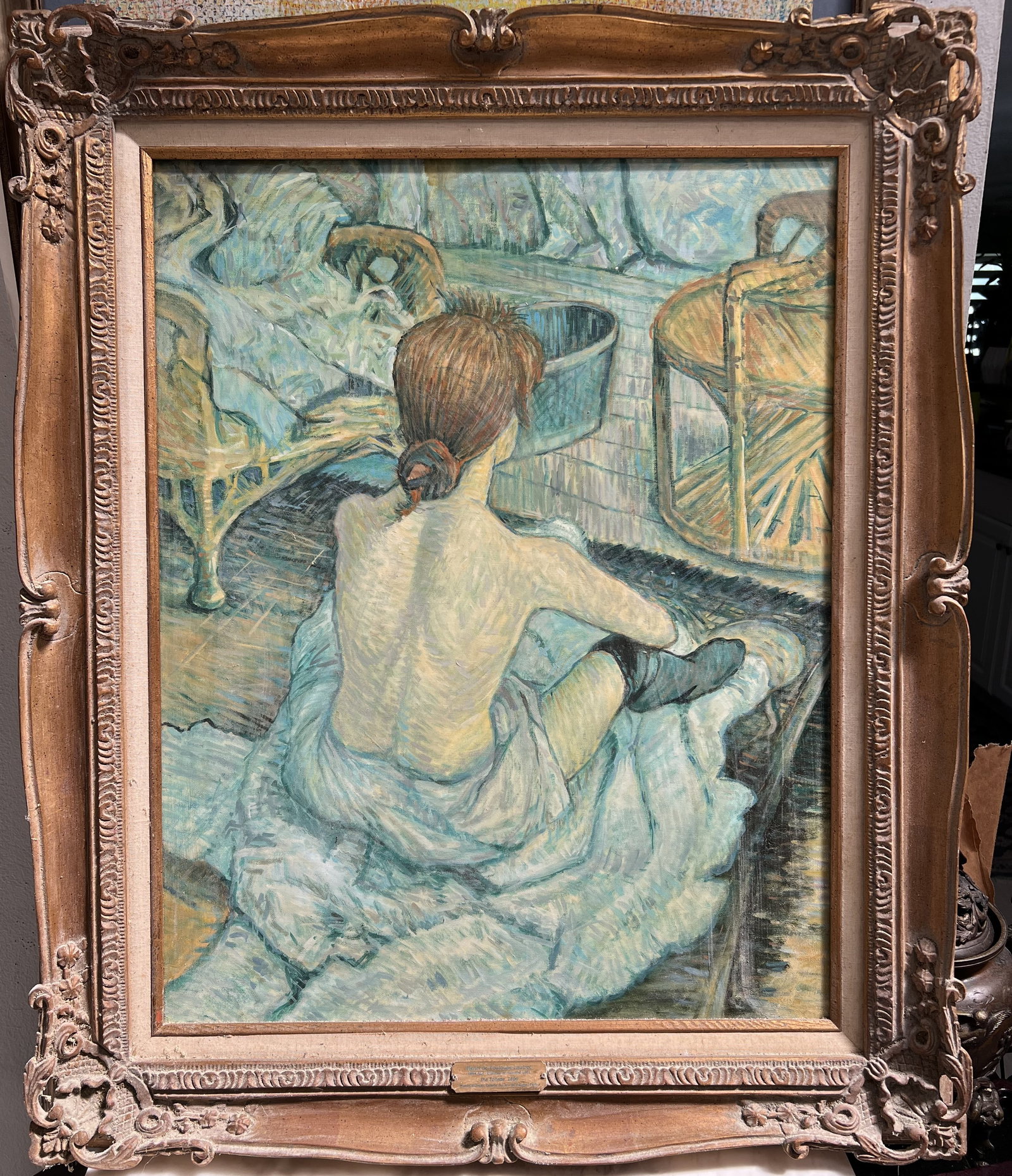 School of Henri de Toulouse-Lautrec oil on canvas: Subject Matter: The image captures a private, "intimate" moment. The woman is seated on a white cloth or chemise, her back bare, with her hair pinned up in a bun. The surrounding environment includes 