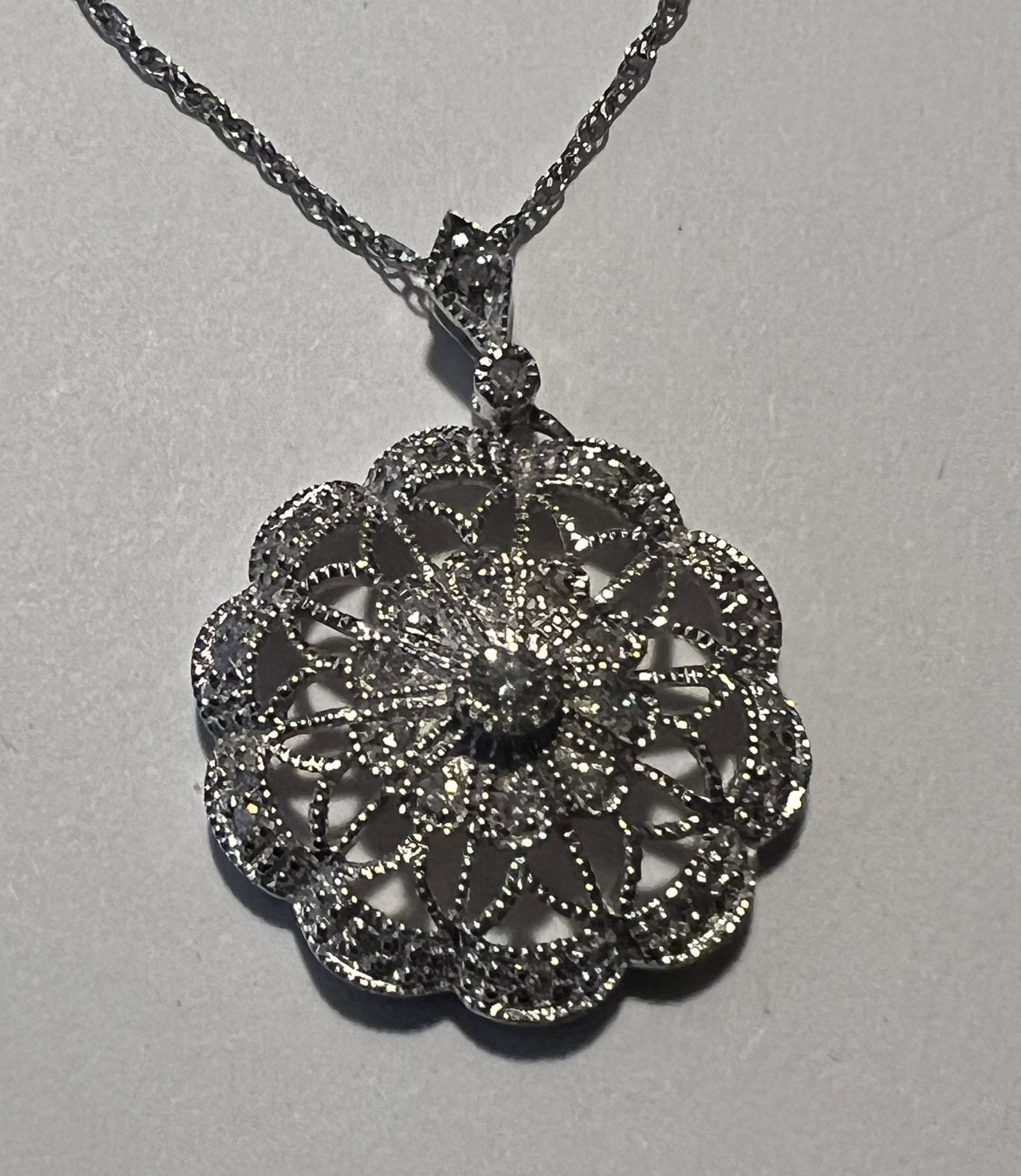 925 Sterling Silver Filigree Floral Pendant Necklace: Item Type: Fine jewelry pendant necklace as seen in image. Style: Vintage-inspired or Art Deco style openwork filigree. The pendant is designed as a scalloped, circular floral rosette or mandala patte
