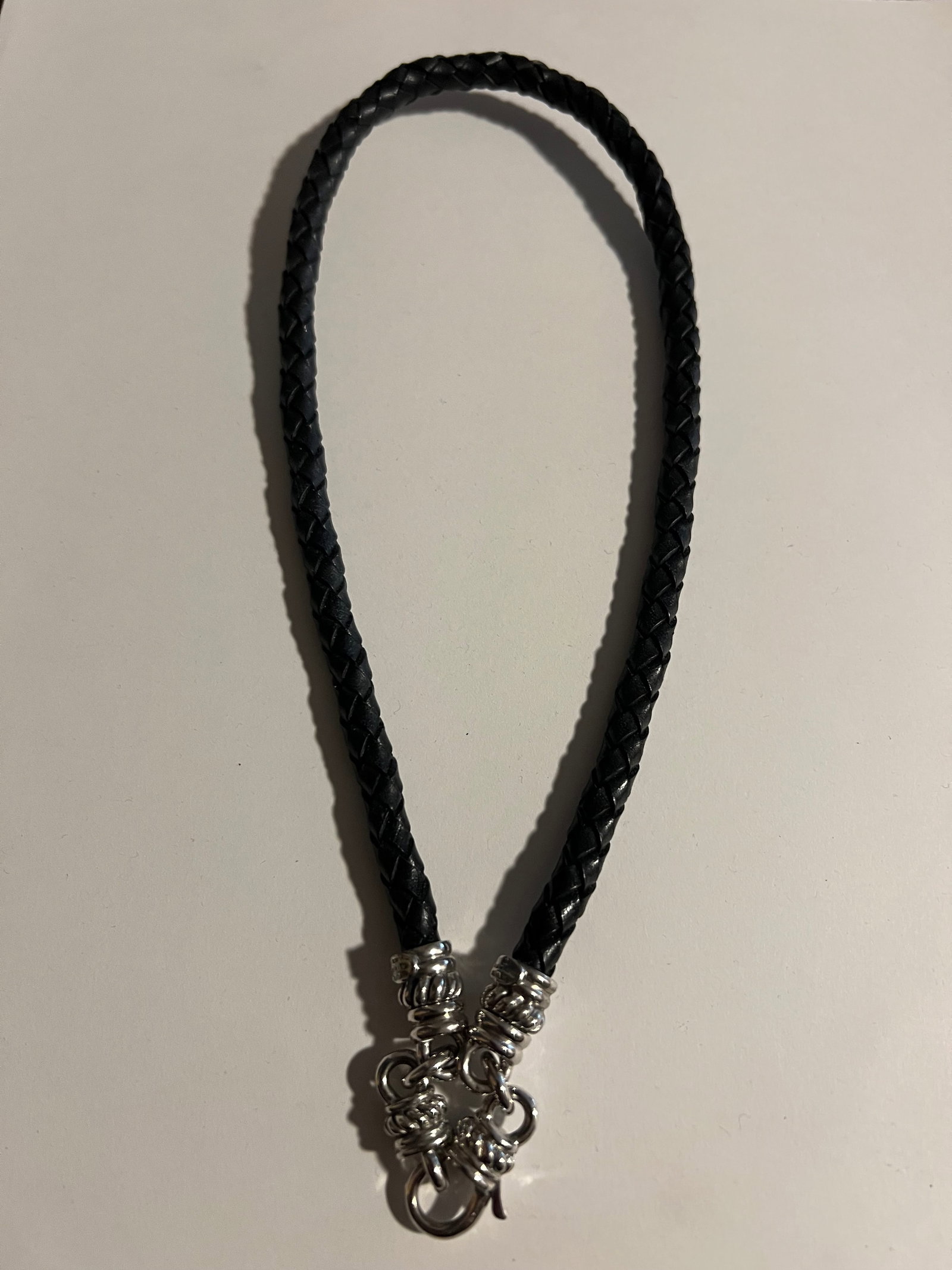 Judith Ripka a modular, versatile braided leather choker/necklace: This classic piece by Judith Ripka is a modular, versatile braided leather choker/necklace designed to function both as a standalone piece and as a custom base for her signature charm enhancers.As see