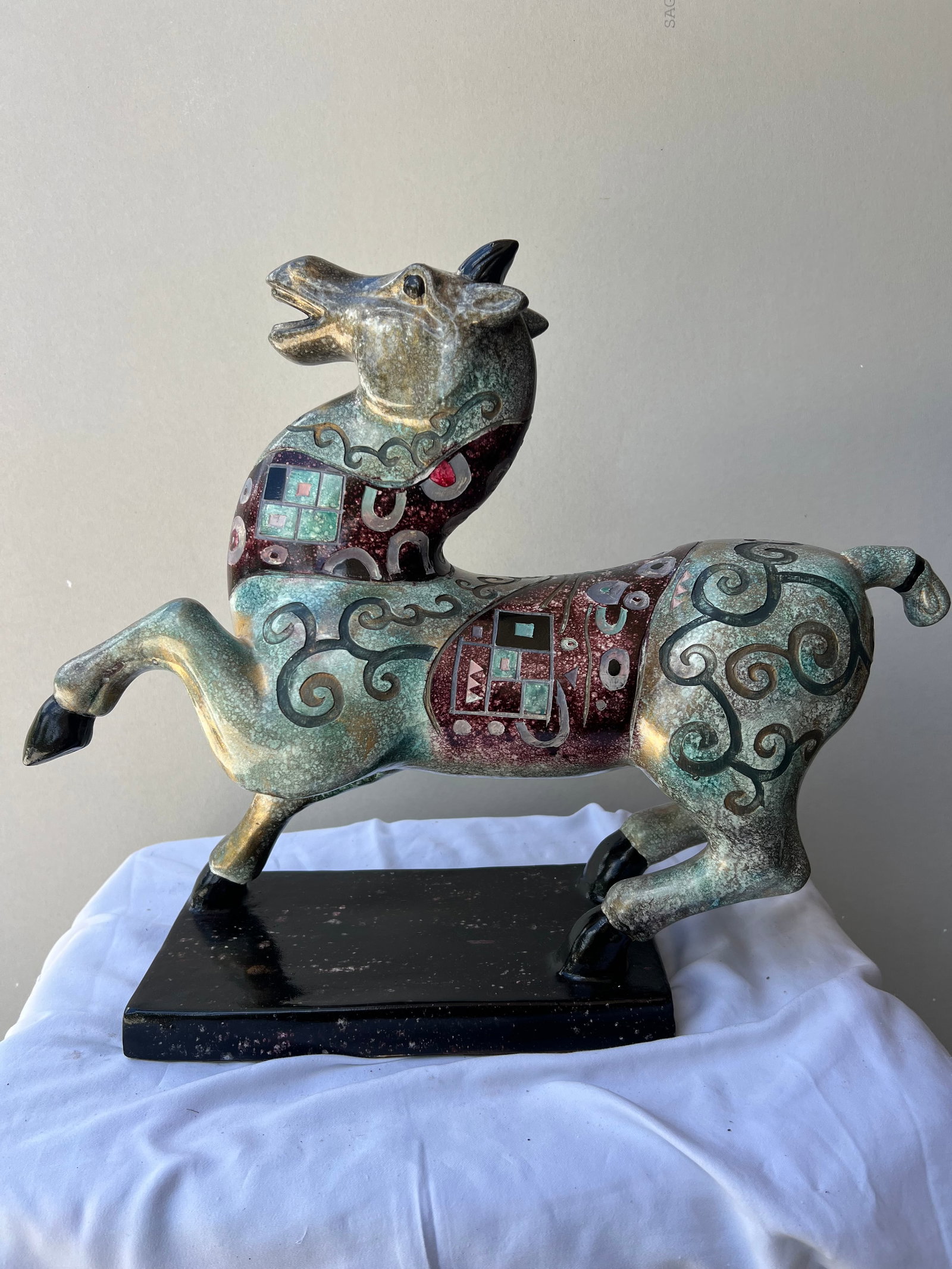Mid-Century Modern Style Archaic Ceramic Horse Sculpture: Style & Form: This is a large, stylized ceramic sculpture of a prancing or rearing horse . Its form draws heavy inspiration from ancient Chinese Han dynasty tomb figures or archaic bronzes, featuring 