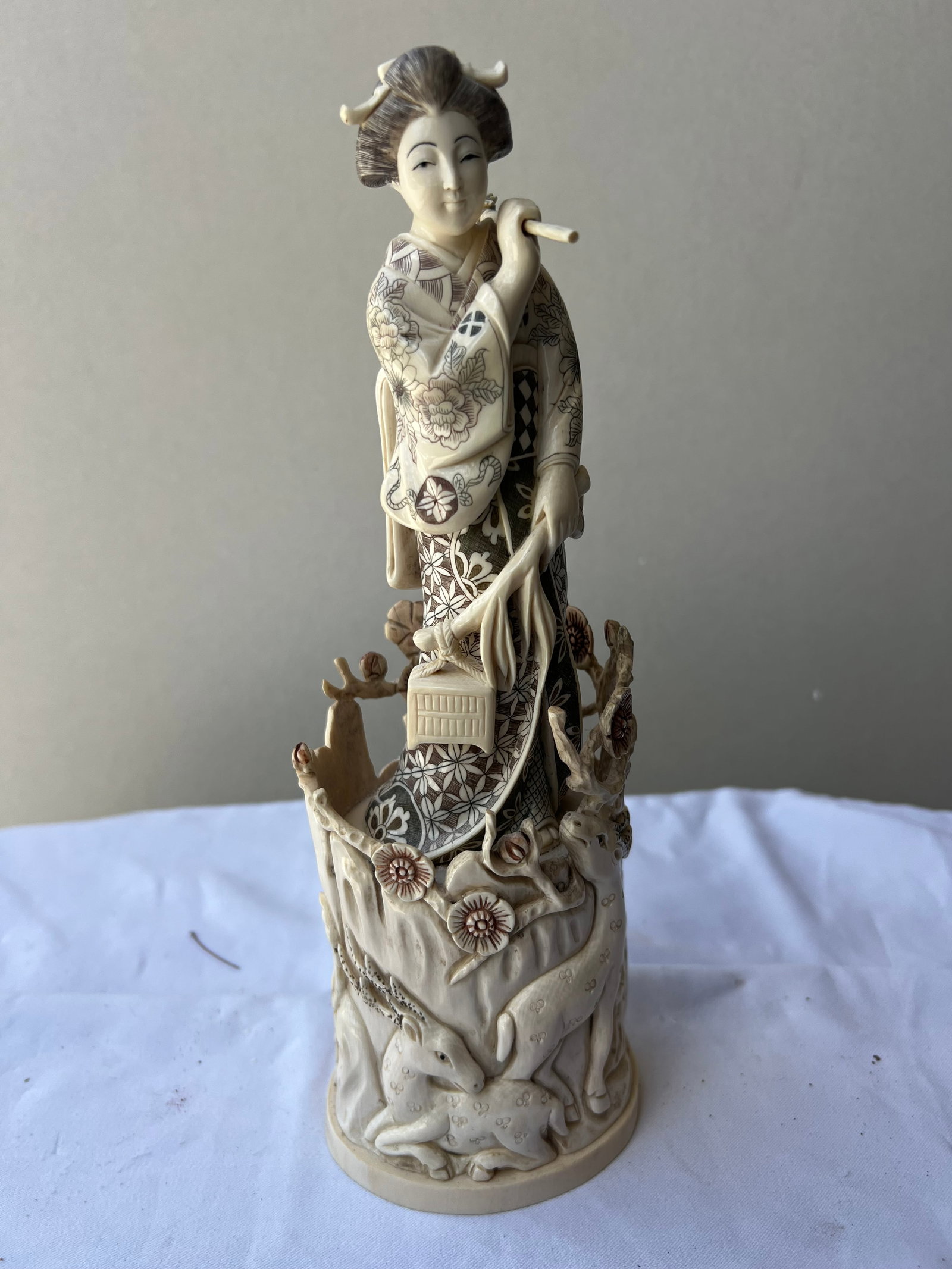 Japanese Meiji/Taisho Style Carved Bone Figurine of a Bijin with Lantern and Deer: Material & Construction: This is a finely detailed, multi-part Japanese-style figural carving depicting a bijin (beautiful woman) or goddess. Per your noted correction, it is meticulously carved from 