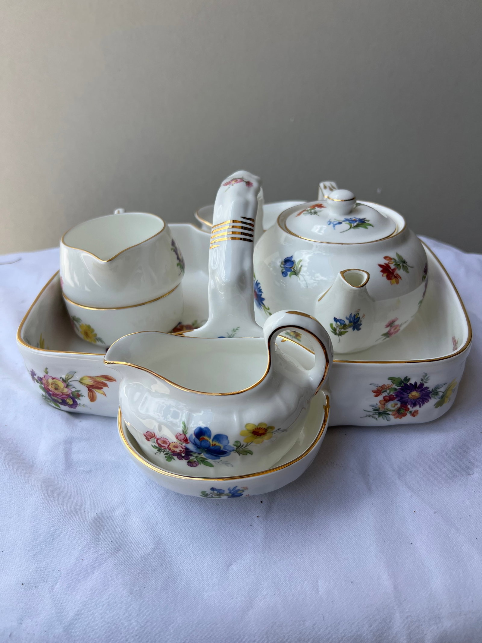 Vintage English Bone China Breakfast Set: Vintage English Bone China Breakfast SetThis is a beautiful, vintage "Tête-à-Tête" or Breakfast Tea Set for One featuring a delicate multi-colored floral pattern with elegant gold-gilt rims.The set