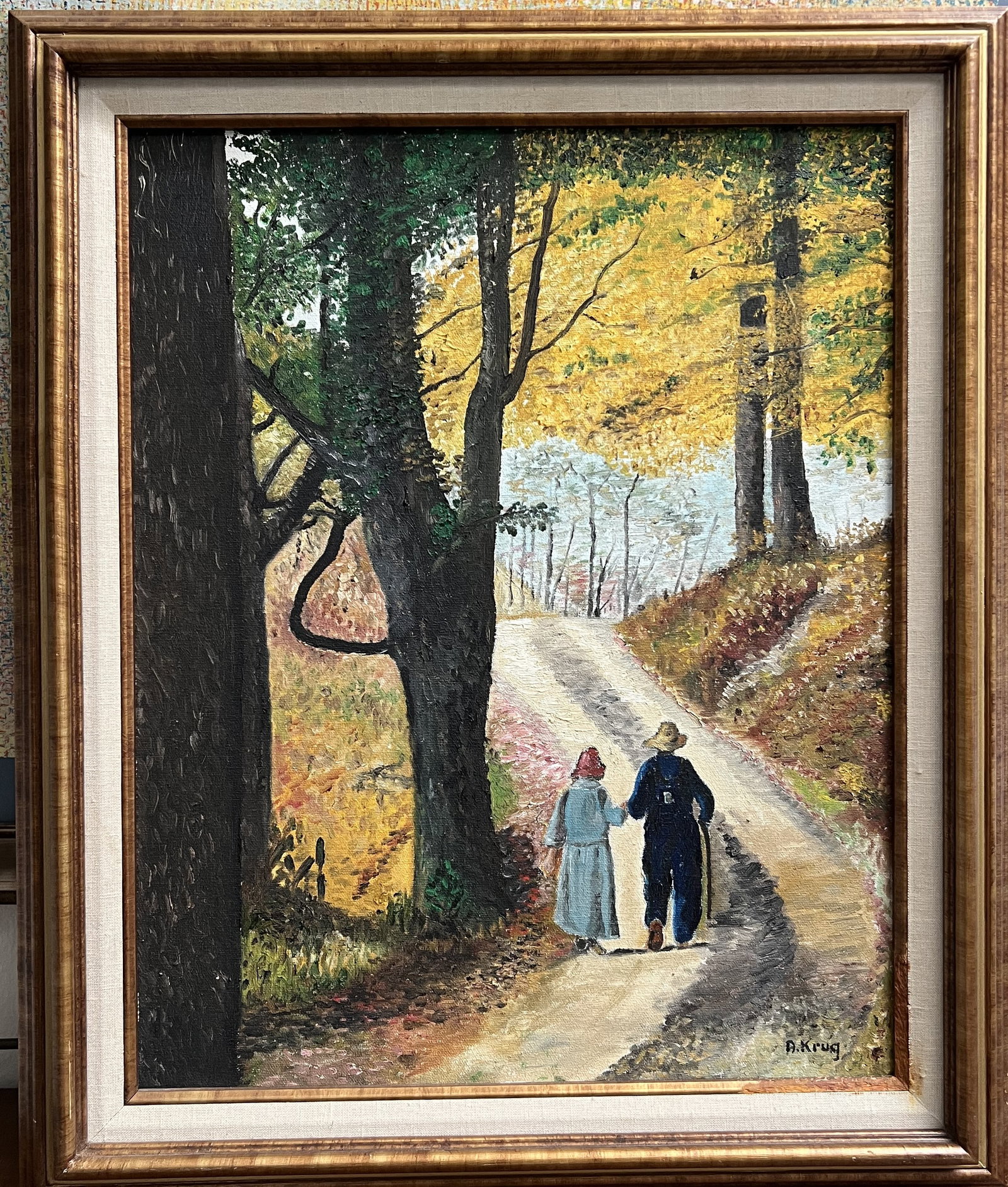 Framed Original Oil on Canvas Landscape Painting Signed A. Krug - Autumn Figures Wal: This original impressionistic oil painting on canvas is signed by the artist A. Krug in the lower right corner. The artwork depicts two figures—a couple holding hands—walking down a quiet, sun-dap