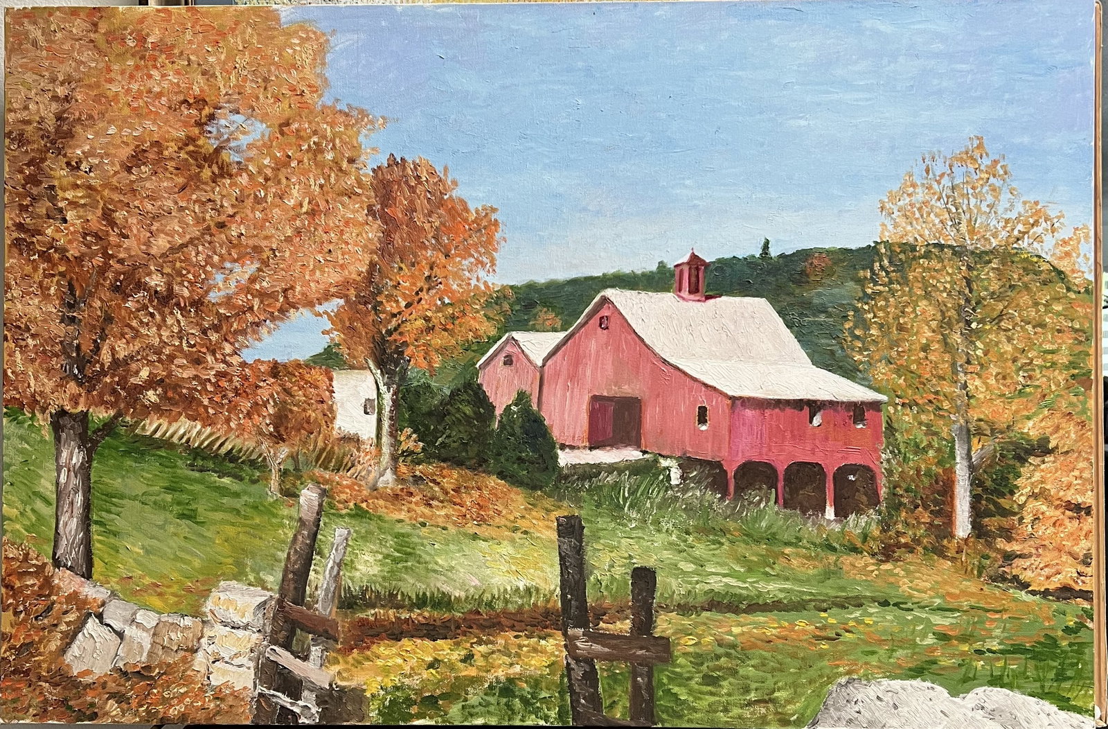 Art Krug Vintage Autumn Landscape Red Barn Painting - Original Oil on Canvas 24x36: This original 24" x 36" oil on canvas landscape painting by Art Krug features a countryside autumn scene centered on a red barn with a white roof and cupola. Rich, warm autumn foliage in shades of ora