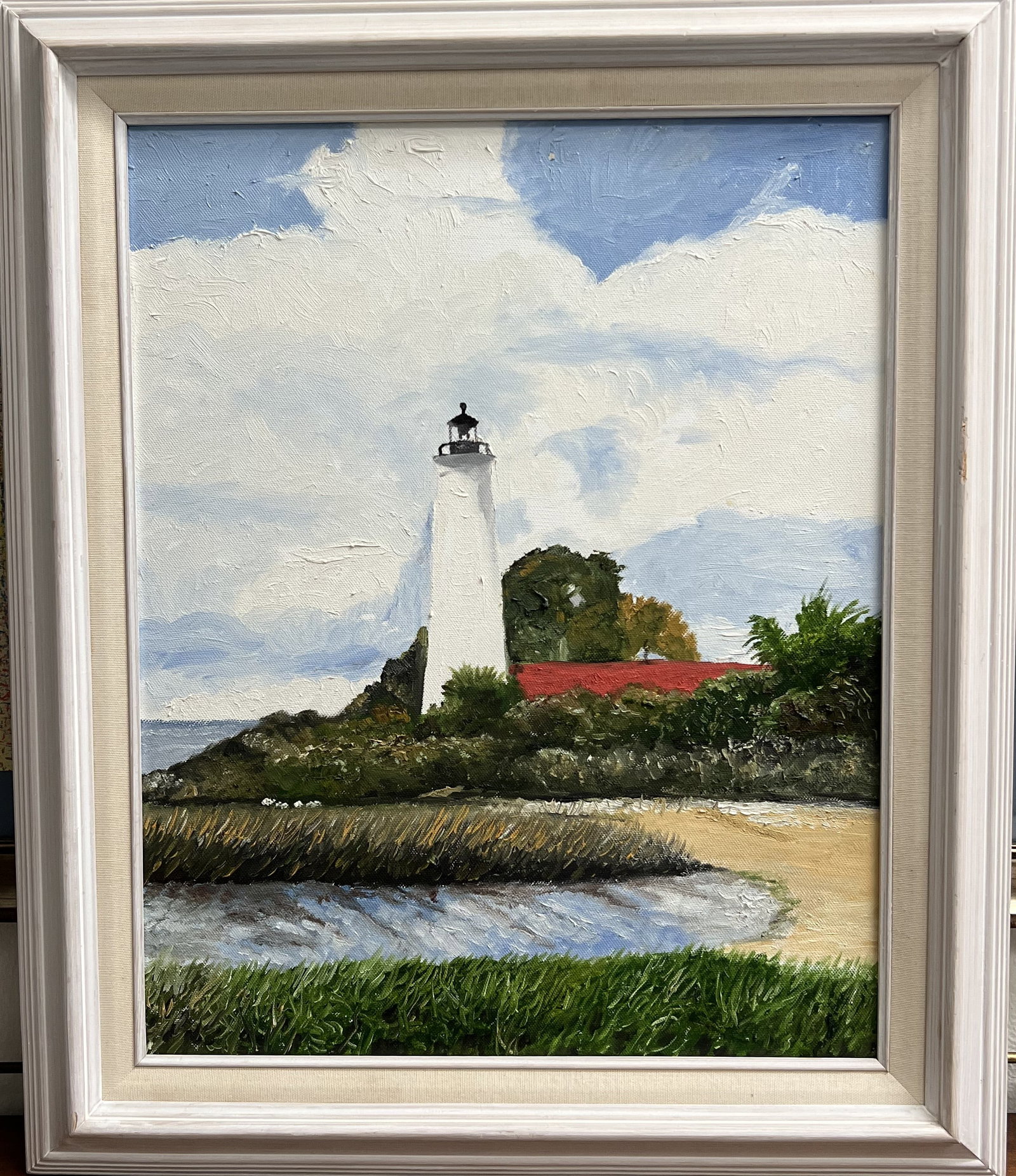 Vintage Original Oil Painting Framed Coastal Lighthouse Art Krug Signed Dated 2004: This original oil on canvas painting depicts a scenic coastal scene featuring a classic white lighthouse set against a cloudy sky, lush greenery, and a red-roofed keeper's dwelling. Executed with text