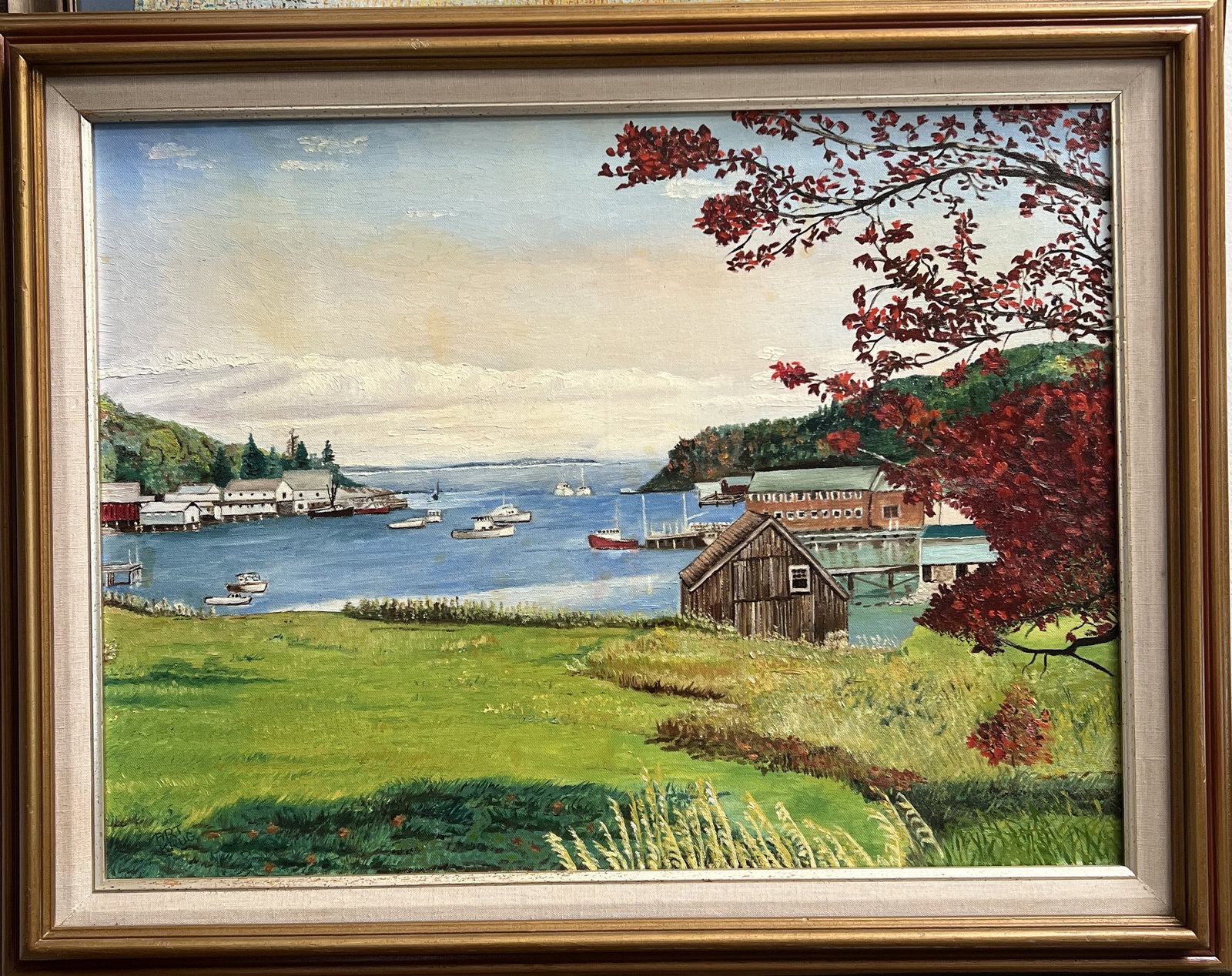This vibrant original still-life oil on canvas features a bouquet of bright yellow sunflowers arrang: Subject: Vibrant coastal landscape depicting a tranquil harbor inlet, fishing boats, rustic shoreline shacks, and a vibrant red autumn tree foreground. Medium: Original oil on canvas. Artist: Signed "
