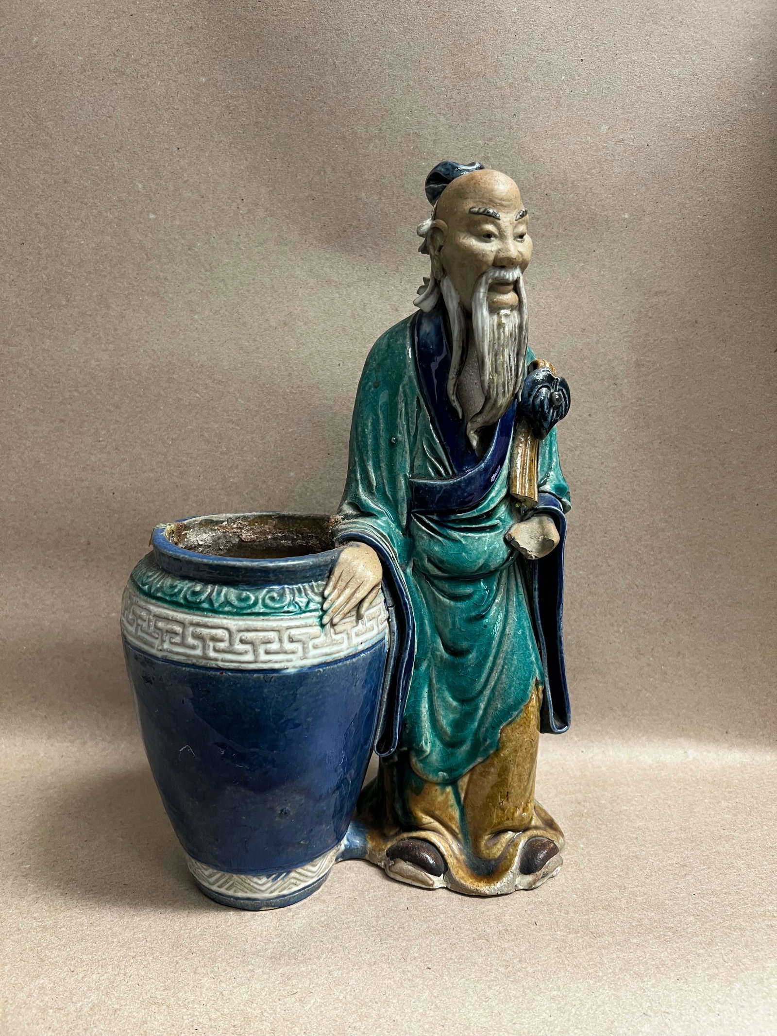 Vintage Chinese Shiwan Pottery Mudman Sage Figurine Planter Pot, Green & Blue Glaze - 12" x 8": This piece is a classic Chinese Shiwan pottery "Mudman" figurine attached to a small decorative planter or jar.Visual Description Subject: An elderly Asian wise man or immortal sage (likely Shou Lao o