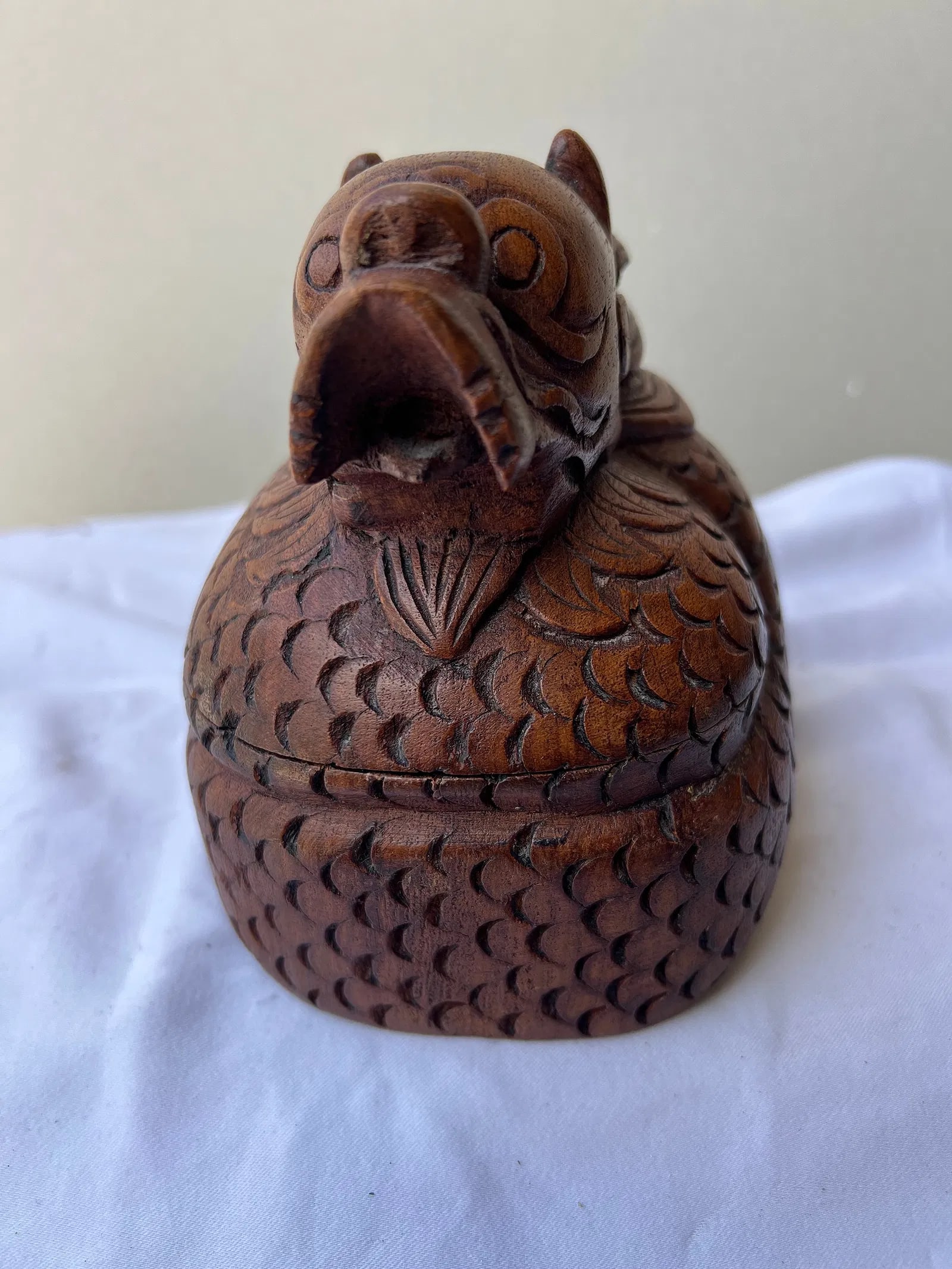 Hand-Carved Wooden Dragon Trinket Box: This is a vintage, hand-carved wooden trinket box shaped like a coiled Asian dragon. The top lid features a detailed dragon head with stylized horns, a prominent snout, and flowing mane, which rests u