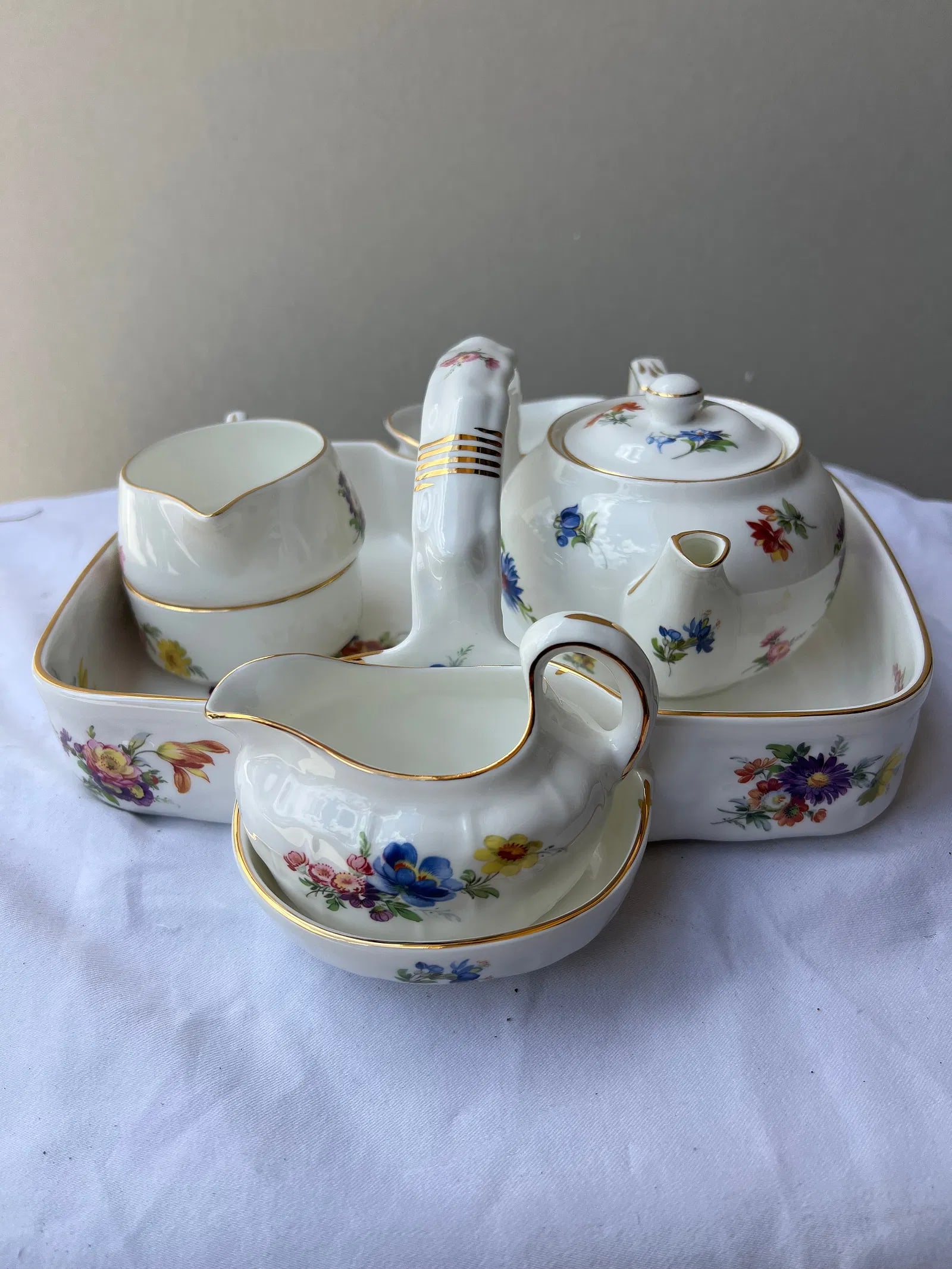 Vintage English Bone China Breakfast Set: Vintage English Bone China Breakfast SetThis is a beautiful, vintage "Tête-à-Tête" or Breakfast Tea Set for One featuring a delicate multi-colored floral pattern with elegant gold-gilt rims.The set