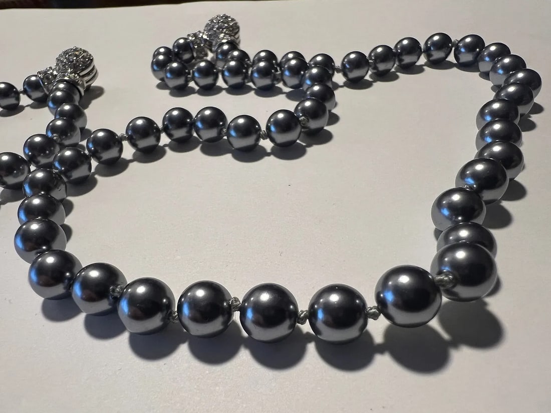 Vintage Nolan Miller Grey Faux Pearl Necklace & Bracelet Set Rhinestone Ball Clasp: This is a sophisticated, authentic vintage costume jewelry matching set comprising a necklace and bracelet by Nolan Miller from the 1980s/1990s "Glamour Collection." Bead Work: The set features high-l