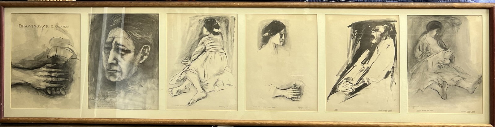 R.C. Gorman multi-panel framed artwork featuring six portrait studies Hand Signed: Panel Configuration: Six individual monochrome (charcoal/graphite style) prints set within a continuous multi-aperture matting in a long natural wood frame. Subjects: The panels display expressive fig