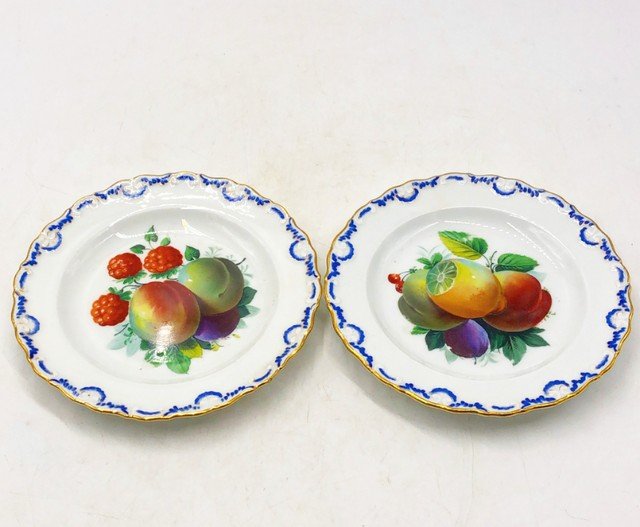 Pair of antique fruit plates with blue & gold scalloped edges: Pair of antique fruit plates with blue & gold scalloped edges. Stamped on backs. Approx 7” dia x 1” deep/thick