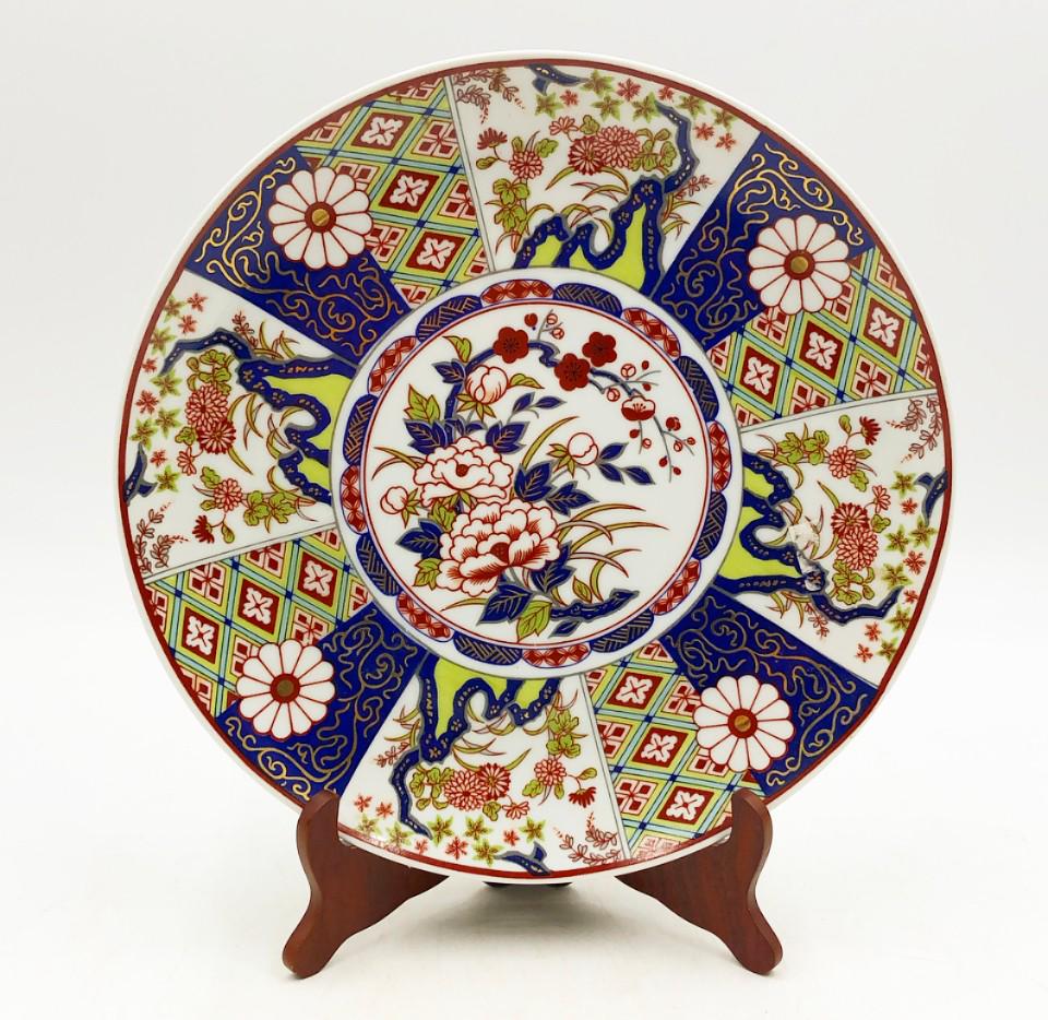 Stamped Imari empress ware larger round platter. Glazed ceramic finish.: Stamped Imari empress ware larger round platter. Glazed ceramic finish. Stand not included. Approx 10.25” dia x 1” deep.