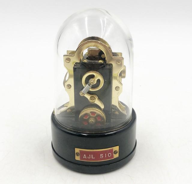 Vintage rare Edison stock ticker tape machine replica.: Vintage rare Edison stock ticker tape machine replica. Metal black base with glass clear dome. Approx 5.75Ó tall with dome x 3.25Ó dia base