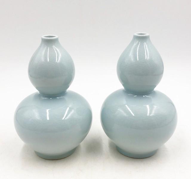 Pair of small light aqua colored double gourd decorative vases with a light crackle style finish\ (1 of 4)