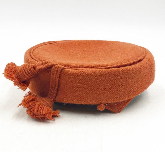 Vintage possibly from the late 1950s pillbox style hat: Vintage possibly from the late 1950s pillbox style hat with 2 tassels, 2 matching pins in a burnt orange heavy fabric. No labels. WomanÕs hat. Approx 2.5 tall x 8 x 7.5