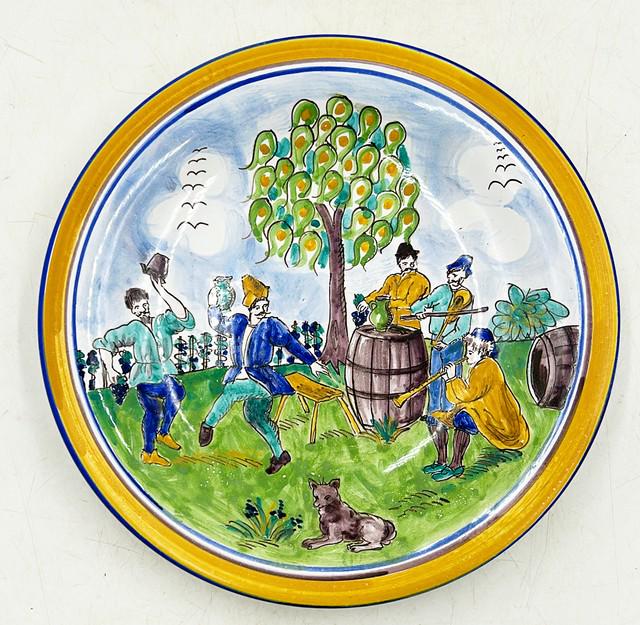 Hand painted pottery plate made in Hungary by Eiabania.: Hand painted pottery plate made in Hungary by Eiabania. Original signature on back as shown in photos. Approx 10 dia x 1.5 deep (inches).