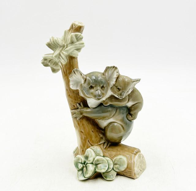 Lladro Koala Love: Lladro Koala Love piece 05461 glazed hand painted/ made in Spain by Antonio Ramos issued in 1988 and retired in 1994. Approx 8.5Ó tall x4.5Ó x 4Ó.